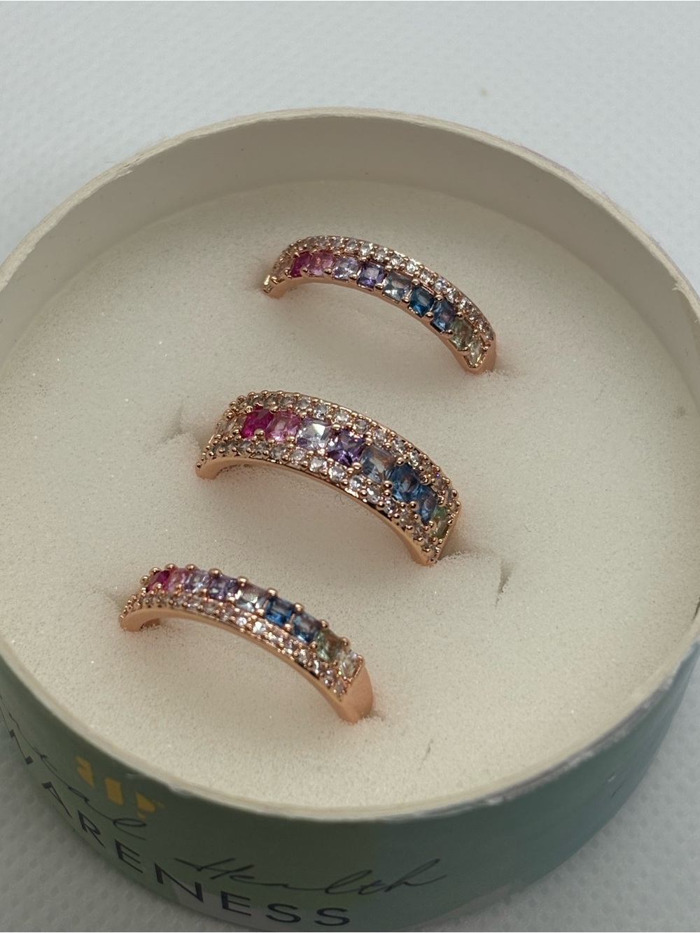 Rainbow Array of Cubic Zirconia Stones in Rose Gold Plating